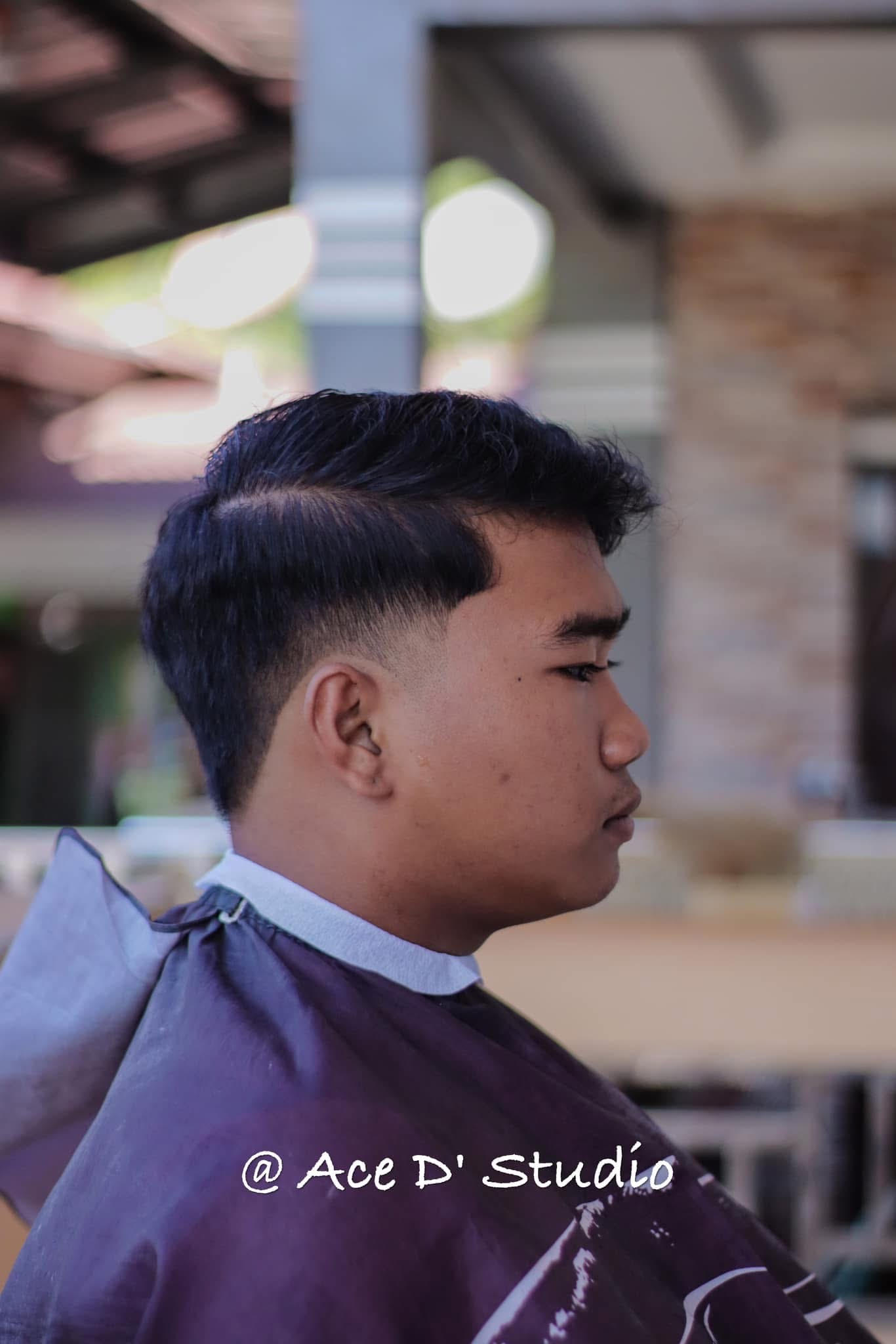 Textured men’s haircut with clean fade